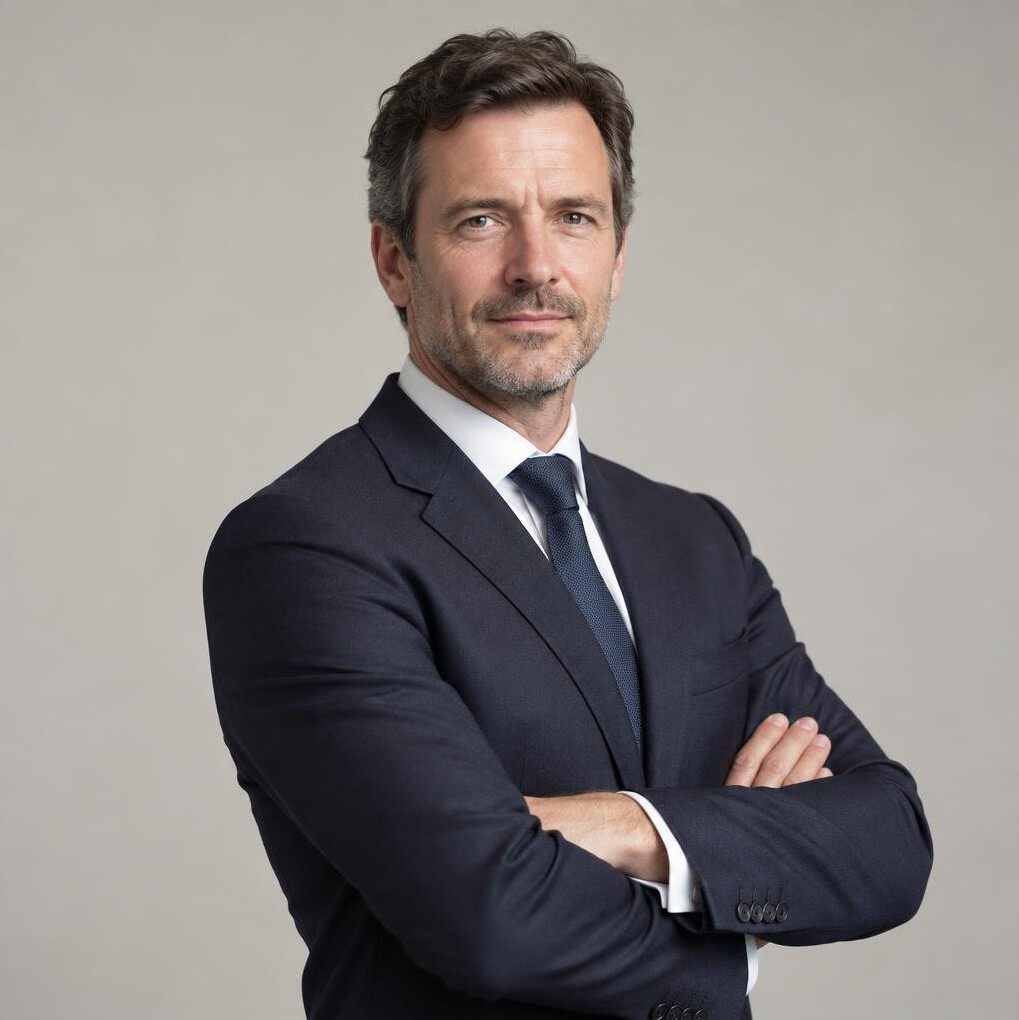 Belgian businessman in a suit looking thoughtfully to the side